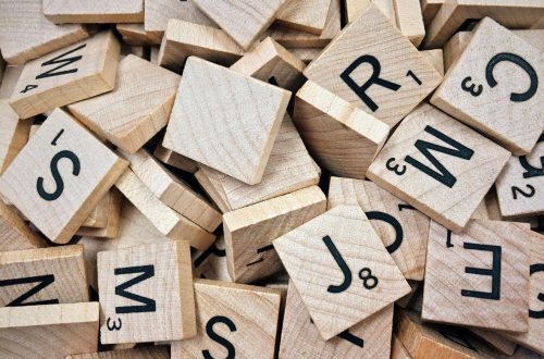 brown scrabble boards with letters