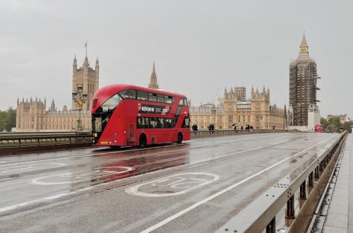 a red bus on the road