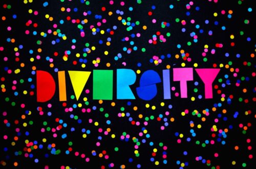 cut out colorful letters on a black surface